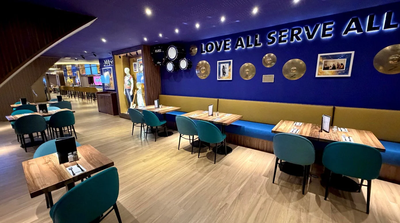 Modern restaurant interior with blue accent wall