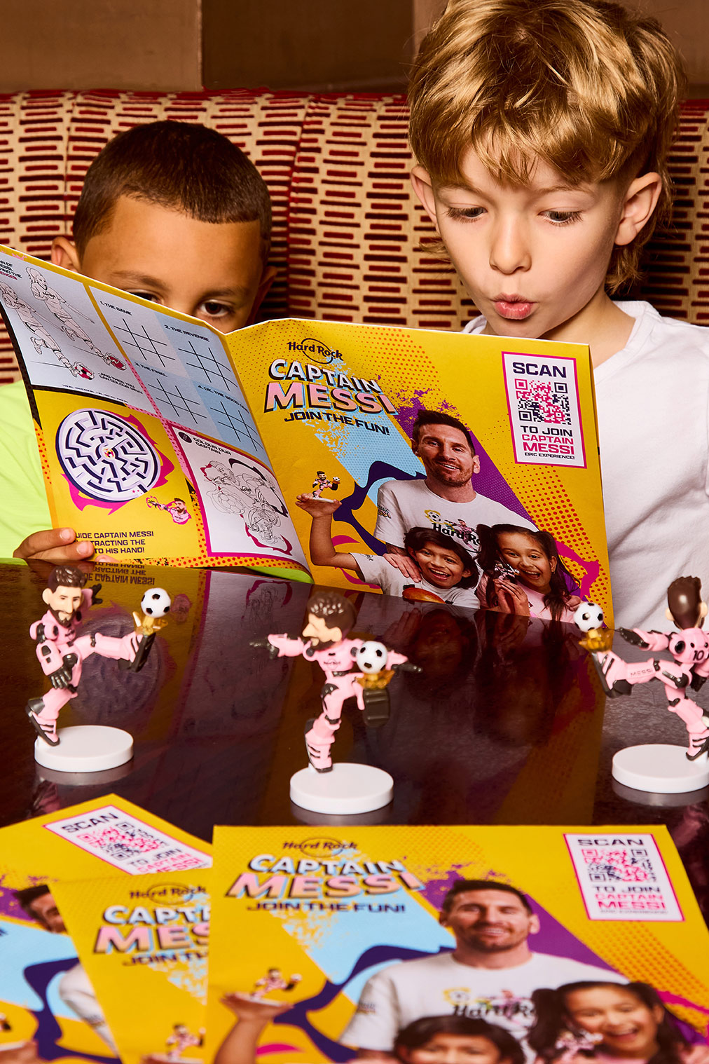 two boys reading a game
