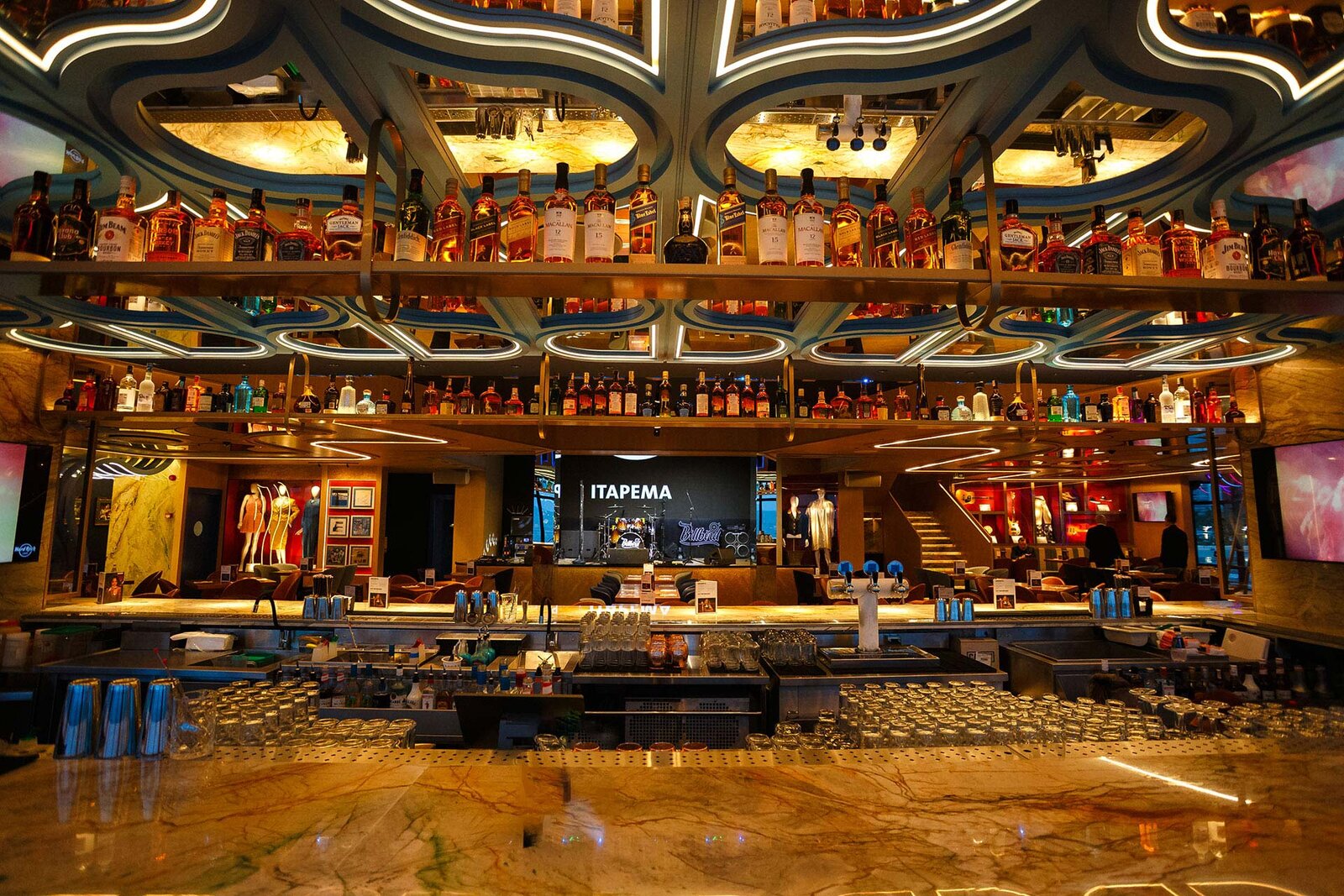 a bar with bottles of alcohol