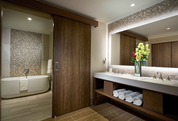 Luxury King hotel room bathroom with free-standing tub