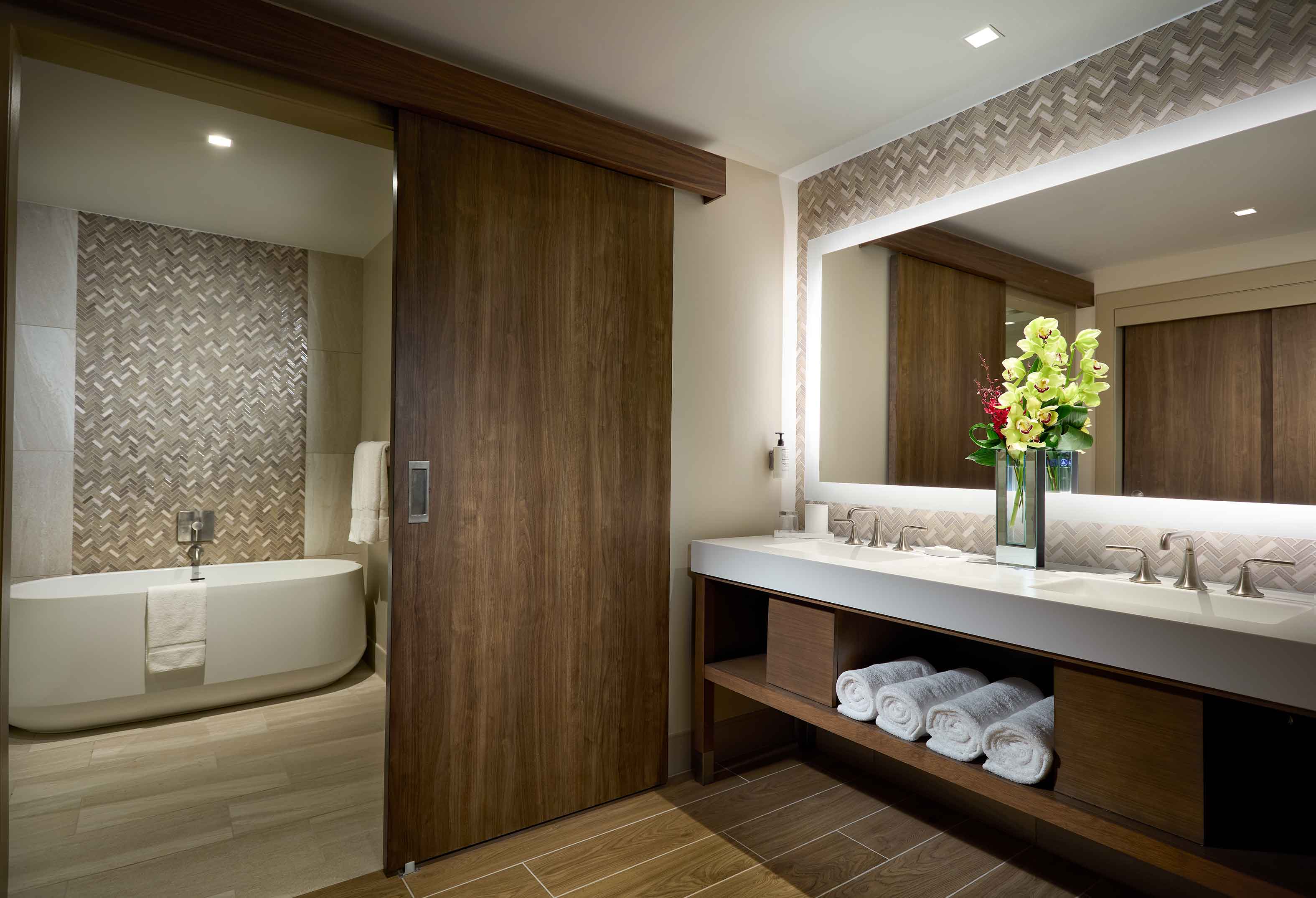 Luxury King hotel room bathroom with free-standing tub