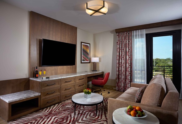 Luxury King hotel room with tv and couch living area