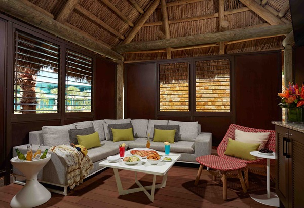 seating area with food and drink in the Oasis cabana