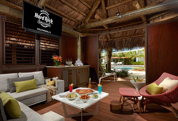 seating area with food and drink in the Oasis cabana