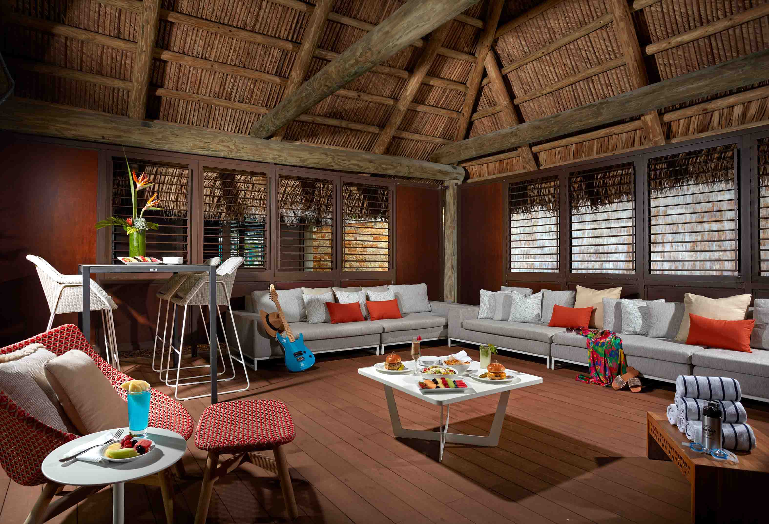 seating area with food and drink in the Oasis cabana