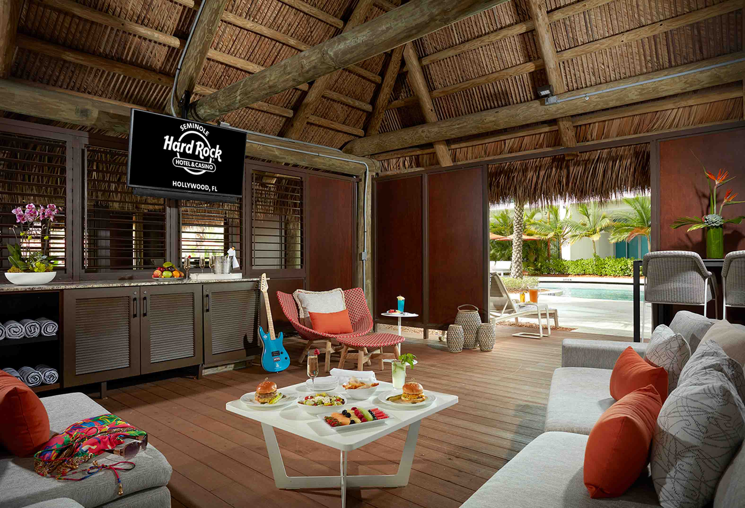 seating area with food and drink in the Oasis cabana