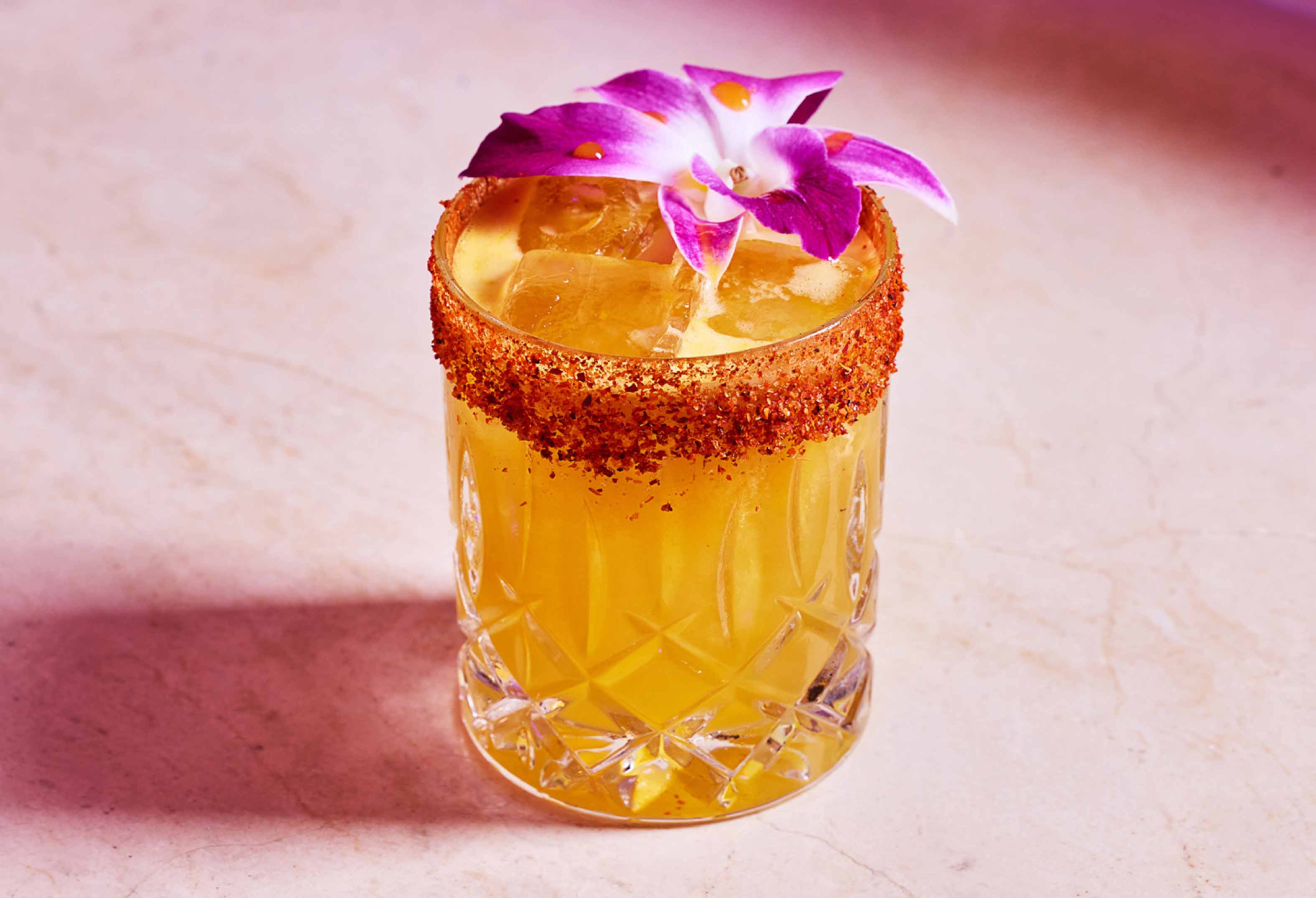 Yellow tropical cocktail with tajin rim at L Bar at Seminole Hard Rock Hollywood