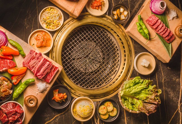 Bae Korean Grill spread of food to cook on grill