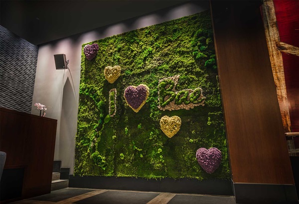 Bae Korean Grill grass wall display with flowers