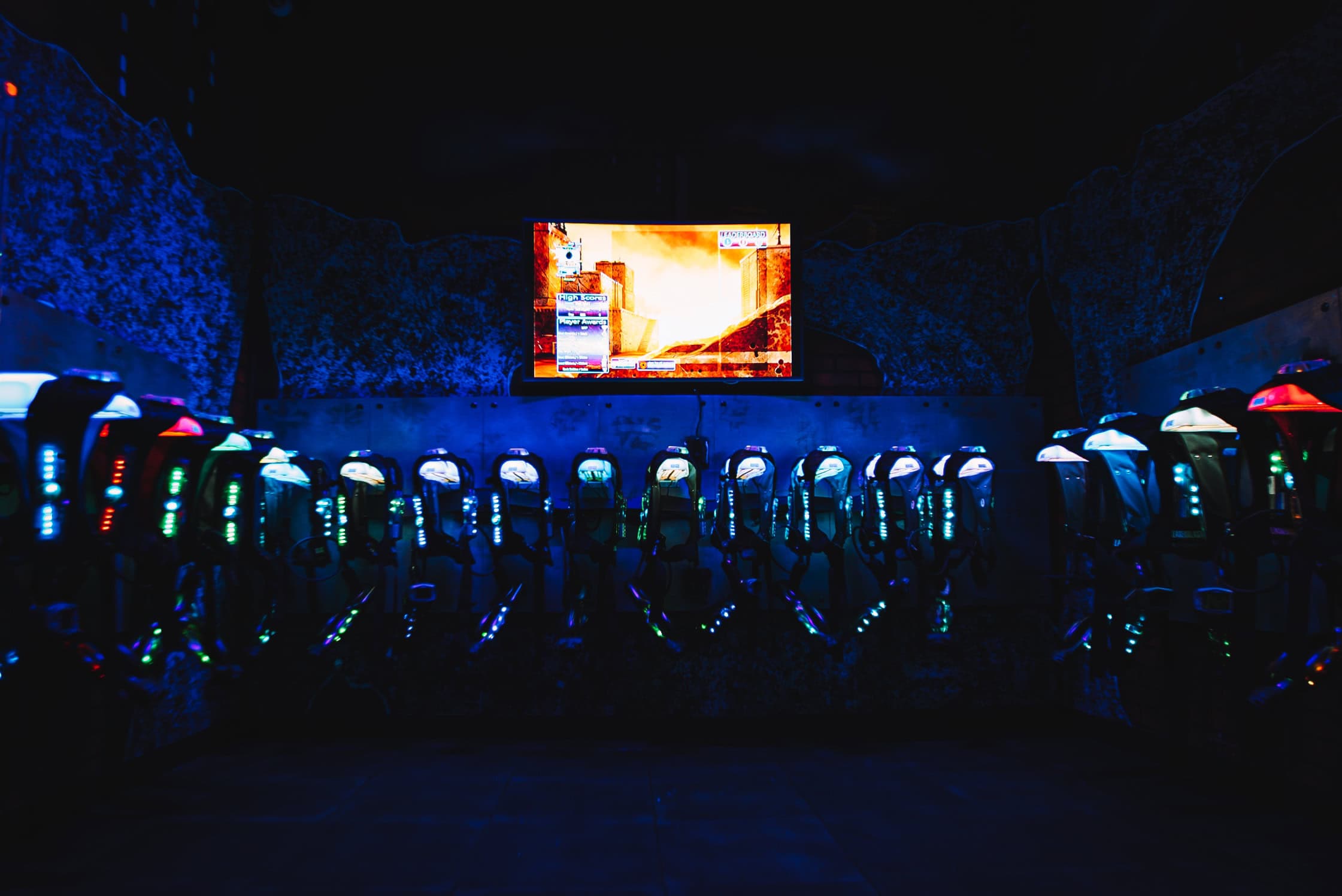 a group of arcade machines in a dark room