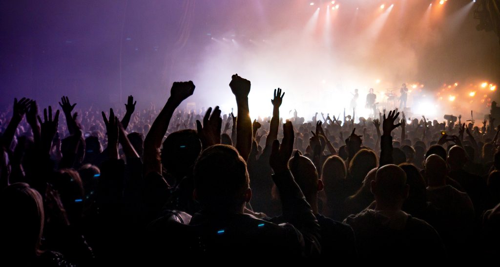 Hands up in a crowd at a concert