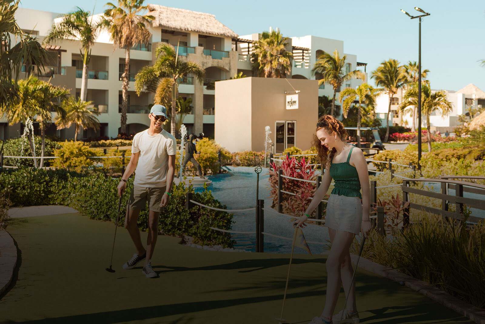 a man and woman playing golf