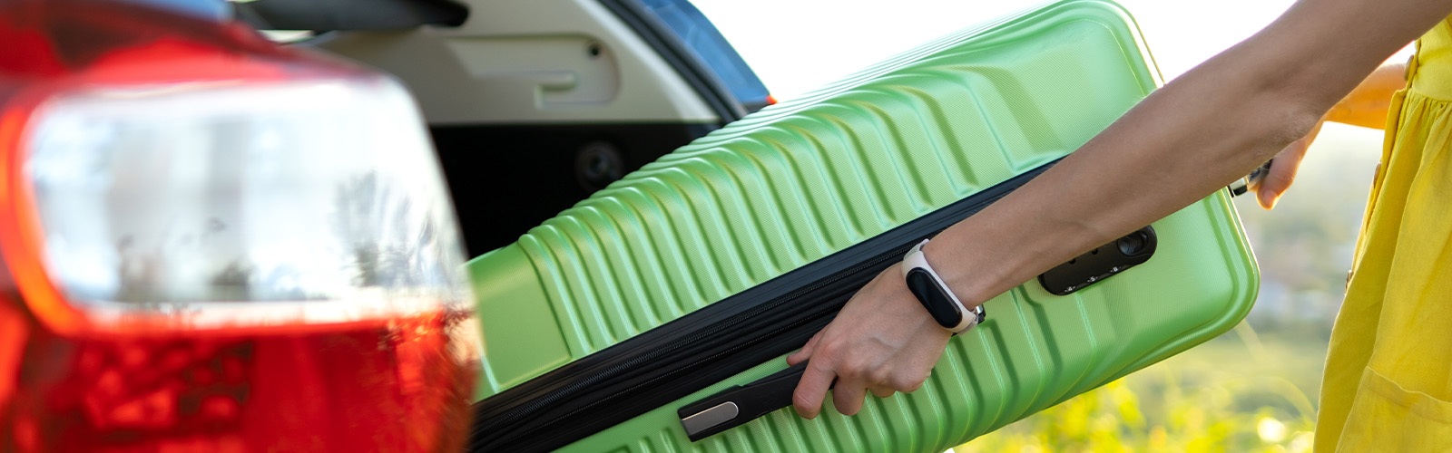 a hand holding a suitcase
