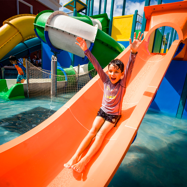 boy sliding down waterslide