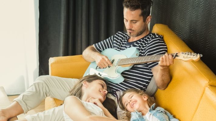 Family with electric guitar